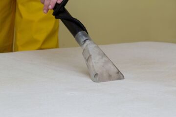 dry cleaning of an old white mattress